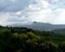 Sulla sinistra la valle incisa dal torrente Rigo e le aspre colline che dal Monte Cetona scendono verso San Casciano dei Bagni e la lontana Acquapendente.